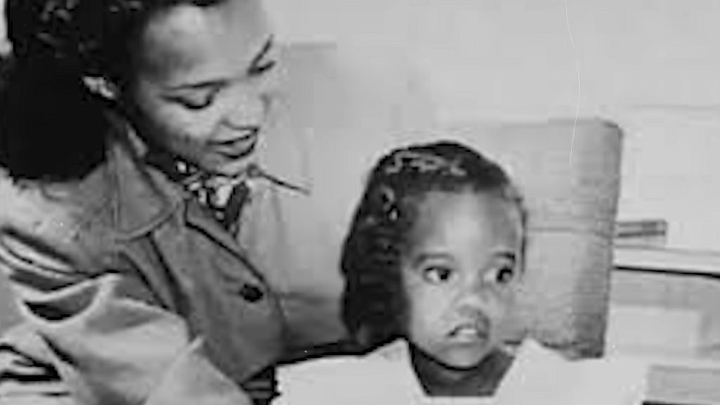 Black and white photo of Dorothy Dandridge with her daughter Harolyn Suzanne Nicholas, smiling as she holds her close