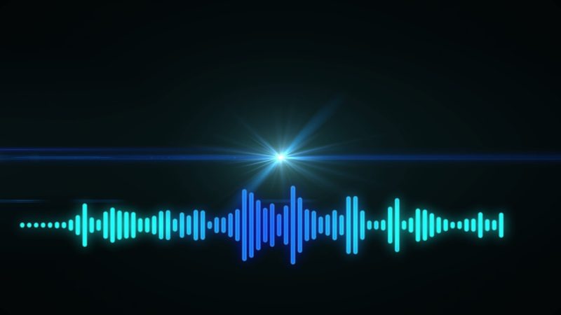 Graphic shows a sound wave pattern with a bright light source above it