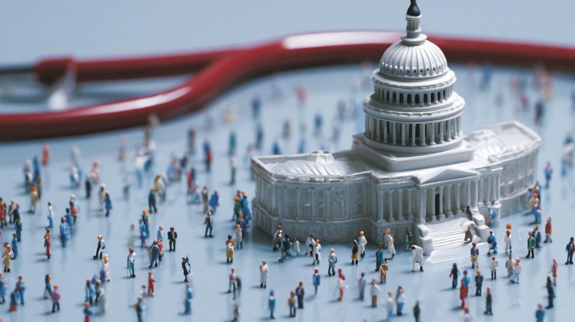 Miniature model of a government building surrounded by small figures, symbolizing public healthcare policy and national insurance reform.